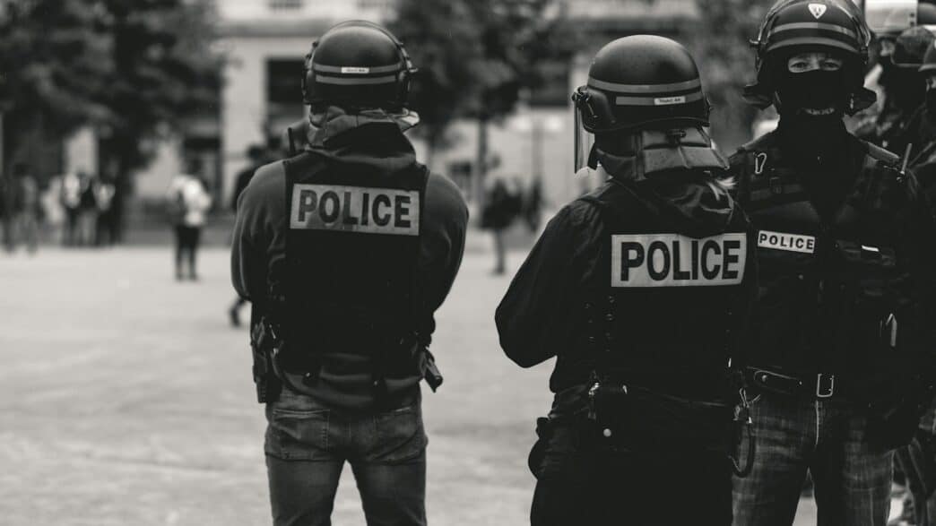 group of police grayscale photo