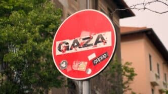 a red street sign sitting on the side of a road