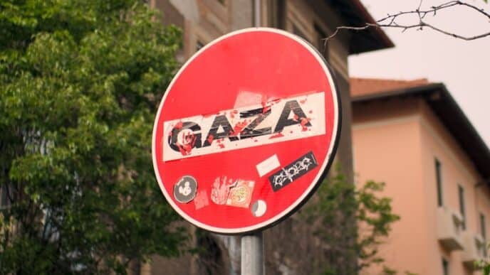 a red street sign sitting on the side of a road