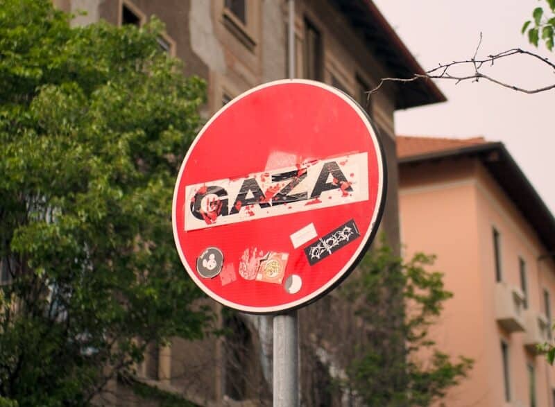 a red street sign sitting on the side of a road
