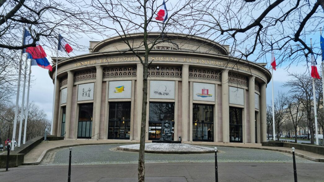 a building with flags flying in front of it