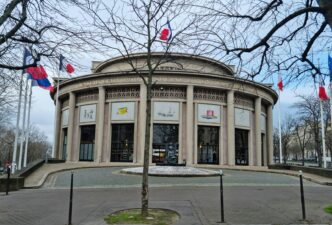 a building with flags flying in front of it